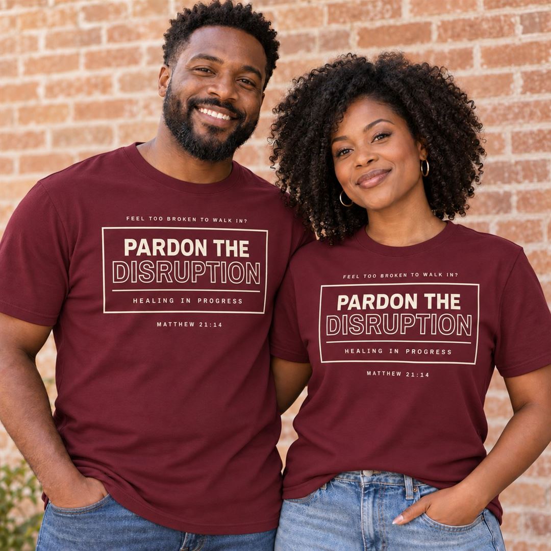 Pardon the Disruption Tee Maroon front